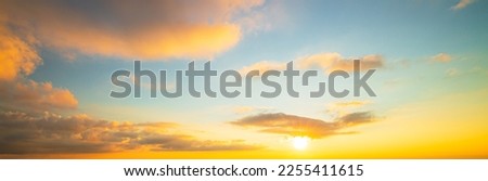 Clouds and evening sky,Real majestic sunrise sundown sky background with gentle colorful clouds without birds. Panoramic, big size Royalty-Free Stock Photo #2255411615