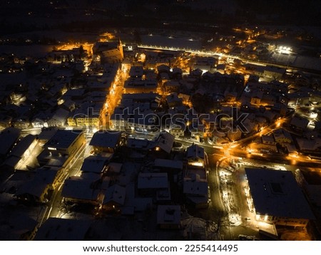 Aerial night view of the village of Kuchl in winter near Salzburg, Austria