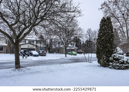 Burlington street covered with snow after a snowy night, Ontario,Canada Royalty-Free Stock Photo #2255429871