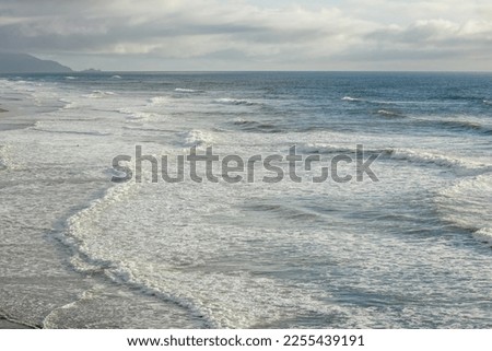 Sea ripples and waves on a Pacific coast beach, California, USA