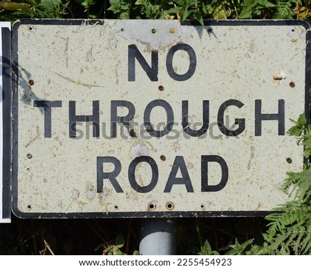 A road sign that advises motorists there is a No Through Road due to coastal erosion, Beach Road, Happisburgh,  Norfolk,  England, UK - 2020