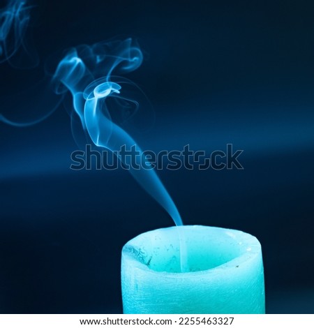 an extinguished candle, smoke from a fading overhang