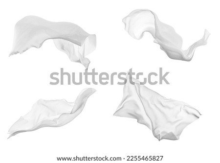 close up of a white fabric cloth flowing on white background Royalty-Free Stock Photo #2255465827