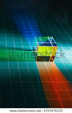 abstract dichroic cube prism with light spectrum dispersion
