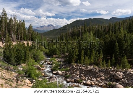 Longs Peak viewed from Lawn Lake Trail, Rocky Mountain National Park, Colorado.   A natural scar of boulders, downed timber are from a breach of  Lawn Lake Dam, July 18, 1982.  Royalty-Free Stock Photo #2255481721