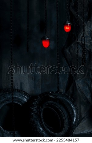 Quest room.Beautiful gothic background. Lanterns against the background of a concrete wall and machine wheels