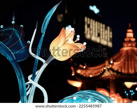 Beautiful flower lantern with blurry Chinese traditional building background, Chinese lantern festival in Shanghai Yuyuan garden.