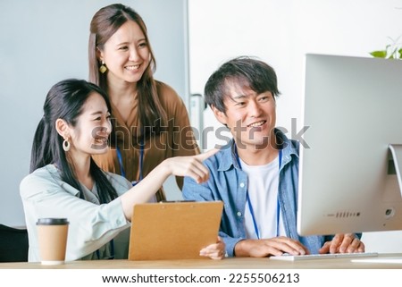Male and female office workers having an online meeting