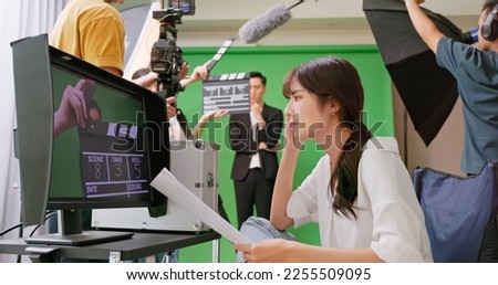asian female Director not satisfiy with process expressing feeling to crew members