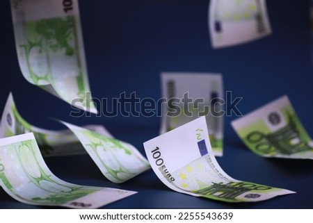 Euro banknotes are falling. The concept financial well-being and successful business decisions.