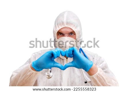 Man doctor medic in a protective suit uniform with goggles and face mask, isolated on a white background. Paramedic in white antiviral protective clothing wearing an N95 respirator and safety glasses