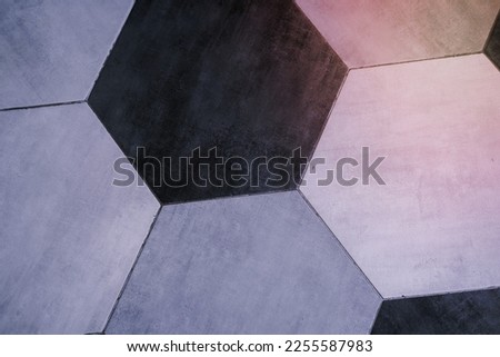 Hexagonal tiles in black and light gray colors. Floor texture from above, flooring, modern minimal interior design