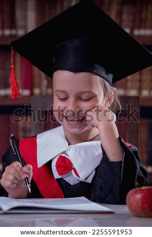 Education, school, knowledge and people concept. Happy beautiful child girl  in graduation cap learning in library. Vertical image. 