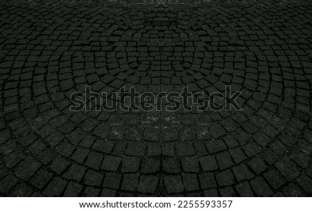 Cobble Circular Pattern. Full Frame Shot Of Paving Stone. Vintage round gray stone pavement. Top view of grey stone pavement pattern.