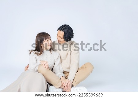 Cuddling Asian casual couple. Commemorative photo of the couple. Pair look. Royalty-Free Stock Photo #2255599639