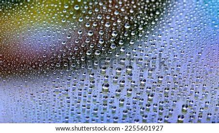 Water drops. Abstract gradient background. The texture of the drops. Multicolor gradient. Textured image. Shallow depth of field. Selective soft focus