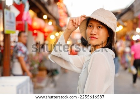 Picture of a woman walking shopping at Chiang Khan Walking Street Market. Chiang Khan District, Loei Province, Thailand