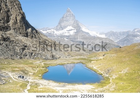 Matterhorn reflection in Riffelsee on a summer day, Zermatt, Switzerland