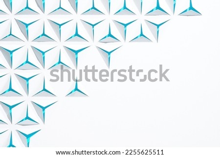 Abstract geometric background with copyspace. Triangles cut out in paper. White and blue color.