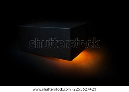 black box with golden light