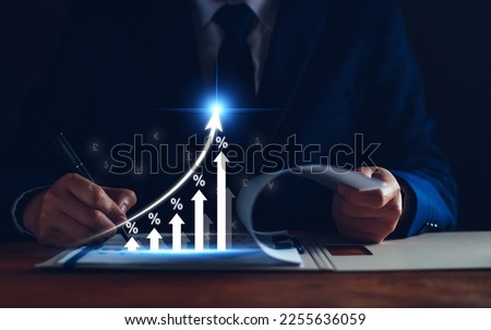 Interest rate and dividend concept. Businessman with percentage symbol and up arrow, Interest rates continue to increase, return on stocks and mutual funds, long term investment for retirement. Royalty-Free Stock Photo #2255636059