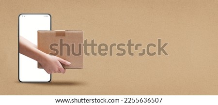 Courier delivering a box on smartphone screen, online express courier delivery service concept, blank copy space Royalty-Free Stock Photo #2255636507