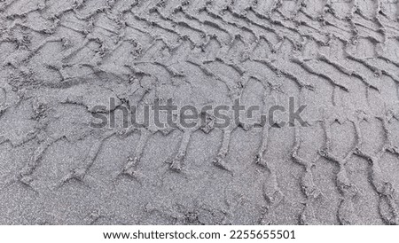 A pattern formed from the ruts of a passing car