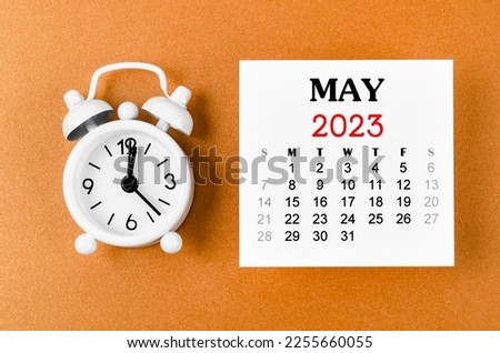 May 2023 Monthly calendar for the organizer to plan 2023 year with alarm clock on yellow background. Royalty-Free Stock Photo #2255660055