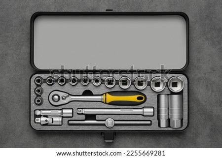 Toolbox for the car repair. Ratchet and bits tool kit. Socket wrench and ratchet heads. Tool kit on gray background. Top view, flat lay. Royalty-Free Stock Photo #2255669281
