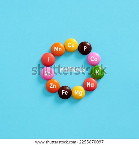 Nutritional mineral supplements. Health care. Minerals, body health and dieting. Essential Mineral symbols for body care on colorful pills. Royalty-Free Stock Photo #2255670097