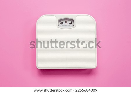 White weight scales on the floor. Weight measurement and loss concept.