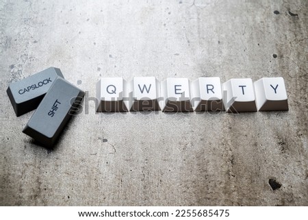 Mechanical keyboard button with "qwerty" text on textured background