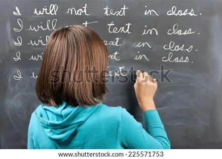 Punished for texting in class. Royalty-Free Stock Photo #225571753