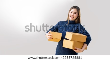 Startup small business entrepreneur SME, asian woman, Portrait of Asian small business owner holding package parcel box isolated on white background, delivery online sell marketing SME concept. Royalty-Free Stock Photo #2255725881