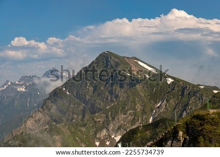 Russia, Sochi, Krasnaya Polyana. Summer landscapes of the Caucasus mountains in Rosa Khutor. View of the peaks of the mountains