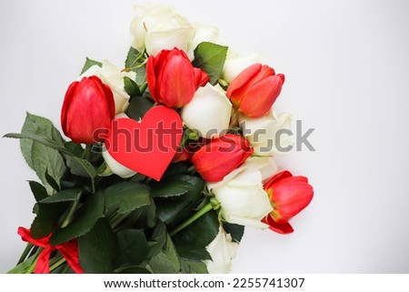 greeting card happy valentine's day. bouquet of tulips and red heart