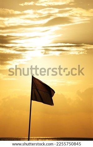 indonesian flag fluttering at sunset