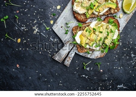avocado toasts with rye bread, Delicious breakfast or snack, Clean eating, dieting, vegan food concept. top view.