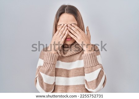 Young blonde woman wearing turtleneck sweater over isolated background rubbing eyes for fatigue and headache, sleepy and tired expression. vision problem 