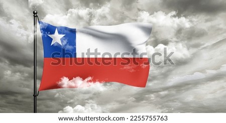Chile national flag cloth fabric waving on beautiful grey sky.