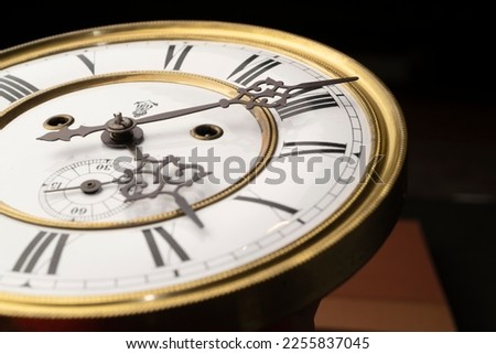 Vintage Clock with Hands. Close up view on clock face of a historical watches with golden frame Royalty-Free Stock Photo #2255837045
