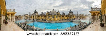 Historical Szechenyi Baths in winter in Budapest, Hungary. The biggest bath complex in Europe. Historic Hungarian thermal baths in Europe. Panorama shot Royalty-Free Stock Photo #2255839127