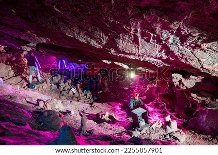 A group of mannekins dressed up like cavers inside Goughs cave in Cheddar in Somerset Royalty-Free Stock Photo #2255857901