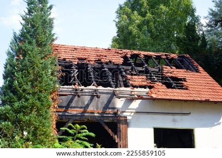 Fire ruin of a small house Royalty-Free Stock Photo #2255859105
