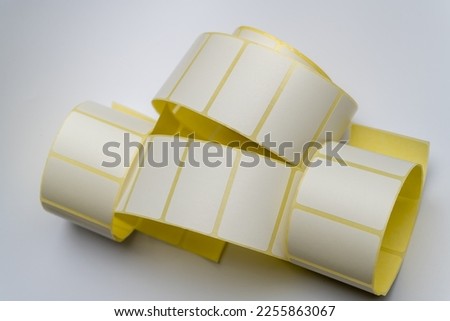 Rolls of white labels isolated. Labels for direct thermal or thermal transfer printing. Blank sticky label roll for thermal transfer printing pirce criss.	