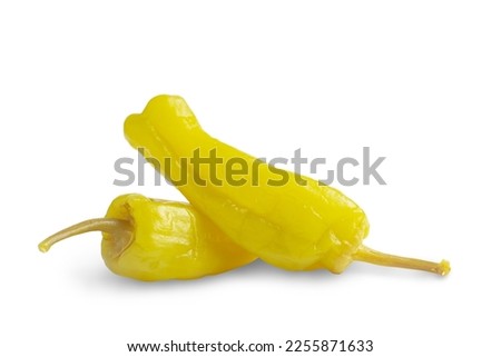Two pickled yellow peppers, pepperoncini or friggitelli isolated on white background. Hot pepper marinated, brined. Traditional Italian and greek cuisine, ingredient for salad, pasta, sauce. Royalty-Free Stock Photo #2255871633