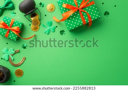 St Patrick's Day concept. Top view photo of green present boxes with orange ribbon bows pots with gold coins horseshoe tie bow clovers and confetti on isolated green background with blank space