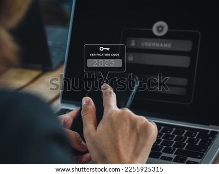 Two steps authentication (2FA) concept. 2023, Verification code and key icon alert on smart phone while using computer for validate password page, Identity verification, cyber security technology. Royalty-Free Stock Photo #2255925315