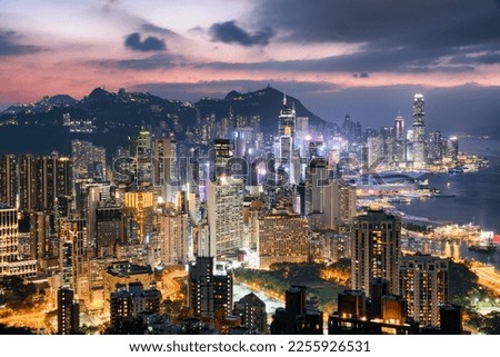 Beautiful aerial view of skyscrapers in downtown of Hong Kong at sunset. Awesome cityscape. Hong Kong is a popular tourist destination of Asia.