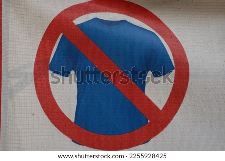 Sign prohibiting wearing clothes in the swimming pool